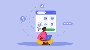 A consumer sits cross-legged on the floor and looks at her laptop, considering which products to buy online, such as a pizza, digital music, medications, books, and travel tickets: what is ecommerce